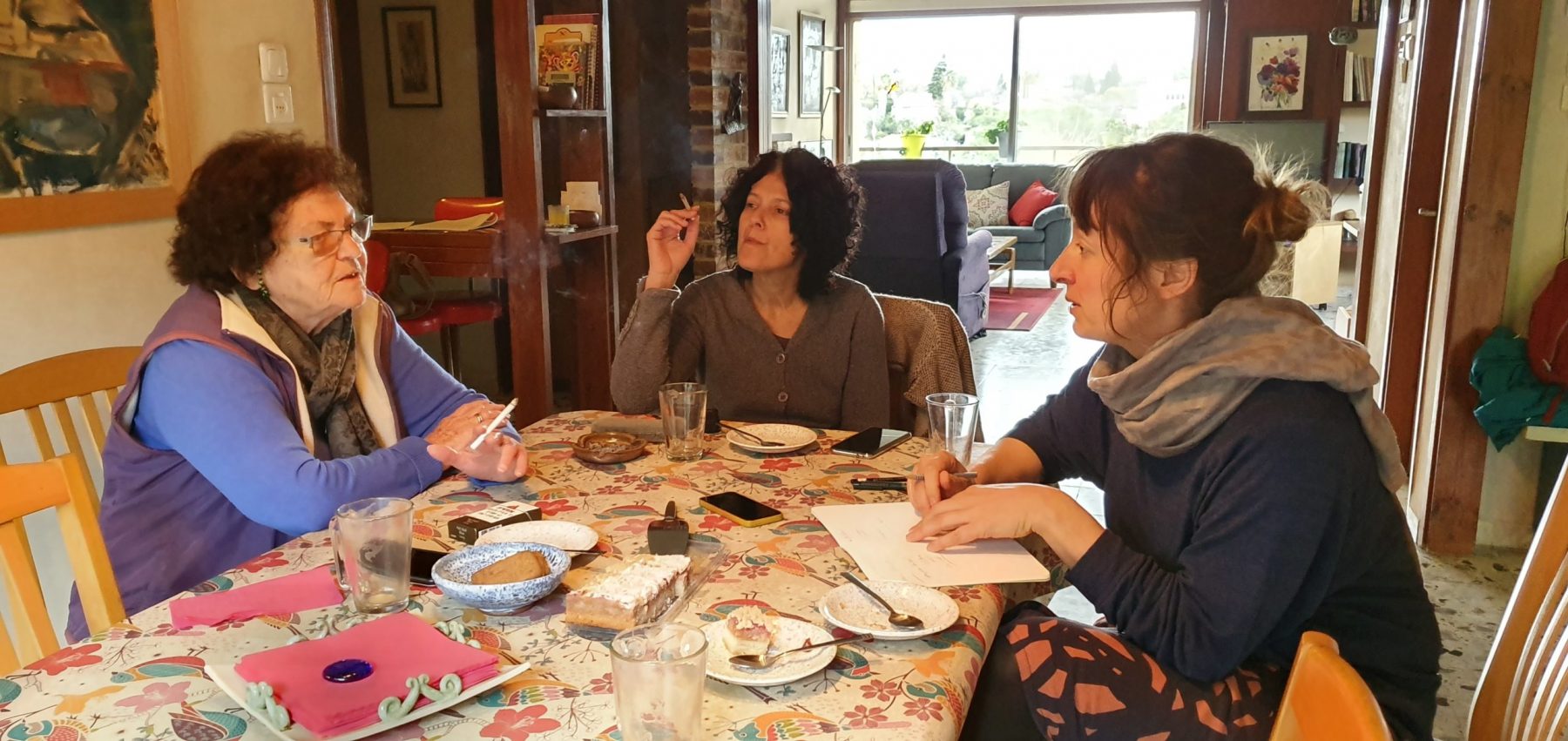 Barbara, Emmie, and Orli around the table